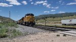UP 6900 Climbs The Grade Heading Towards Soldier Summit Utah with US-6 To the Right of Her.